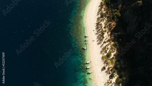 aerial view island with tropical sandy beach and palm trees. Malajon Island, Philippines, Palawan. tourist boats on coast tropical island. Summer and travel vacation concept. beach and blue clear sea © Alex Traveler