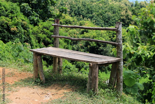 Wooden Bench on the hill road side with mountain and forest at Rangamati, Bangaldesh. It is mainly used for people relaxing, panoramic top view observe.