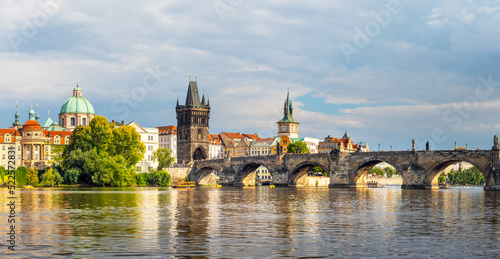 waterfront view across the river Vltava to the Charles Bridge and Old Town Bridge Tower  Prague  Czech republic