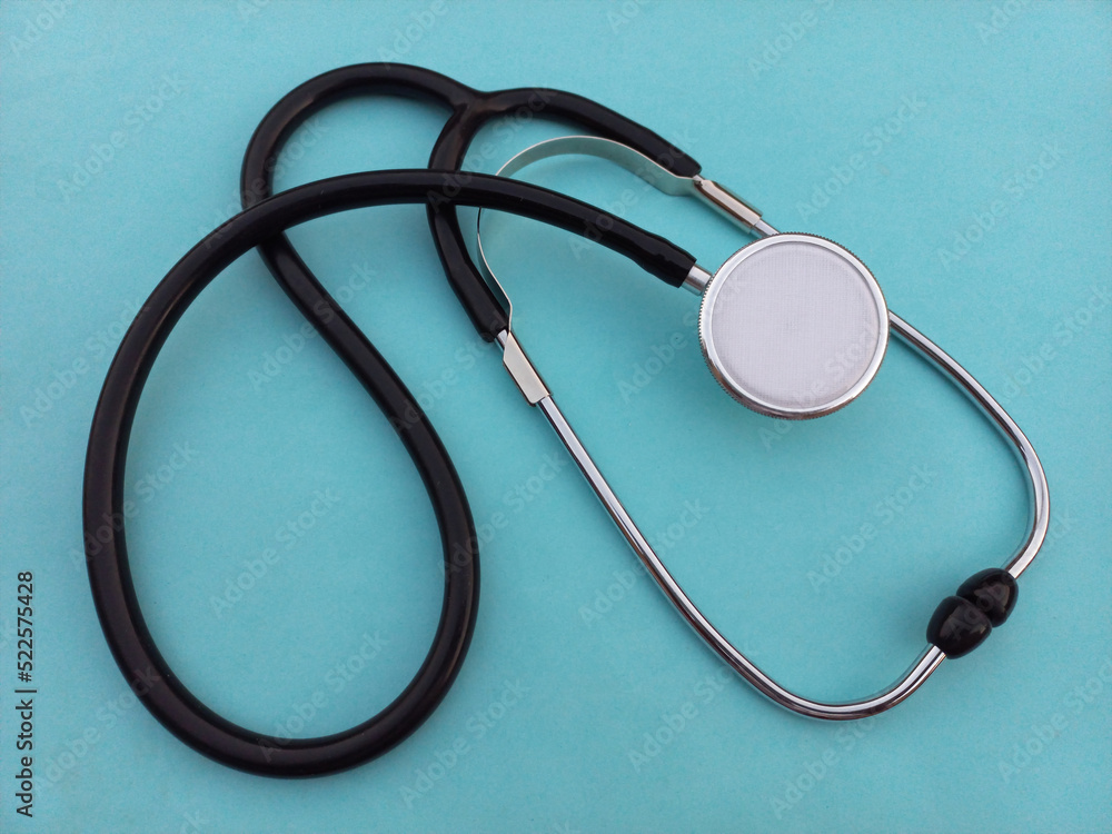 stethoscope ,Black stethoscope on blue background stethoscope ,Black stethoscope on blue background