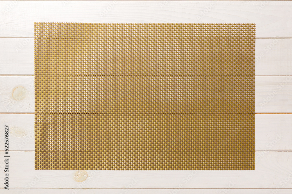 Fototapeta premium Top view of brown tablecloth for food on wooden background. Empty space for your design