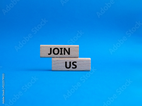 Join us symbol. Concept word Join us on wooden blocks. Beautiful blue background. Business and Join us concept. Copy space