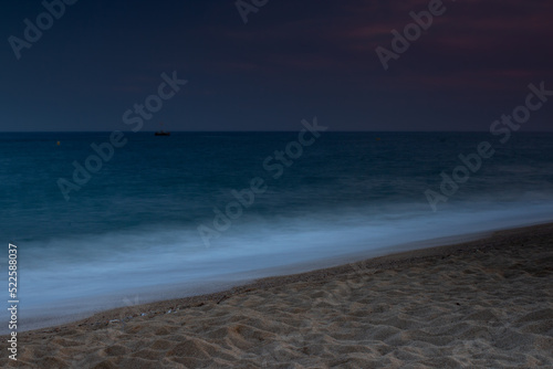 Wieczorem na plaży Costa Brava w Malgrat de Mar photo