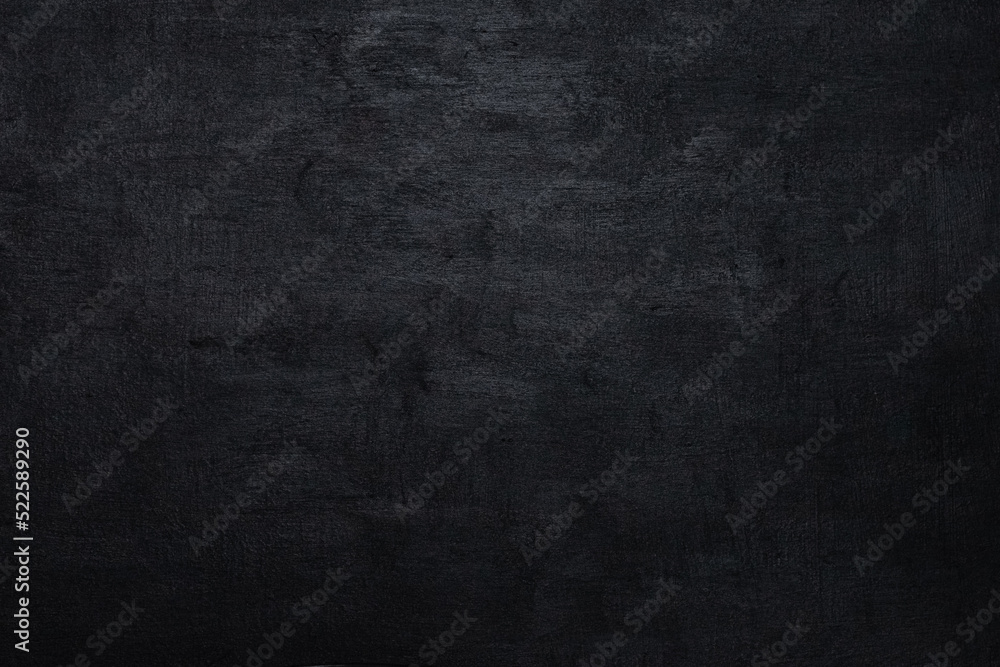 Black slate paint. School board for writing with chalk. Academic year. Textured black background. The blackboard with black slate paint.