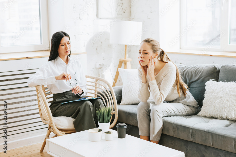 psychological consultation young Asian specialist psychologist or coach conducts a session for a patient of a young woman, problem solving, mental health psychological consultation young Asian specialist psychologist or coach conducts a session for a patient of a young woman, problem solving, mental health