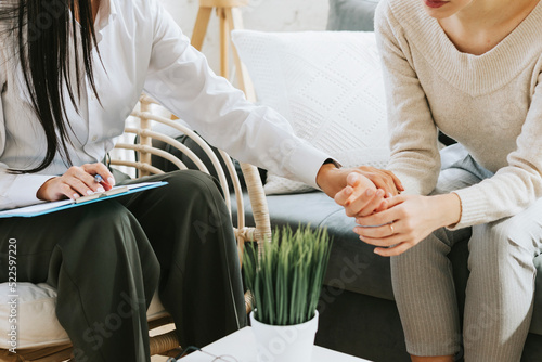 psychological consultation young Asian specialist psychologist or coach conducts a session for a patient of a young woman, problem solving, mental health