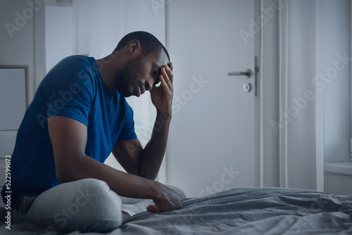 Vászonkép Unhappy African American Man Suffering From Depression At Home