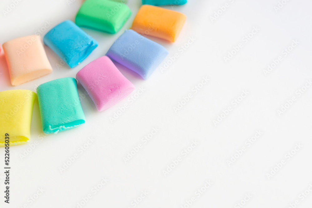 Colorful molded plasticine clay isolated on white background with copy space for text. Creativity children toys concept. Colorful molded plasticine clay isolated on white background with copy space for text. Creativity children toys concept.