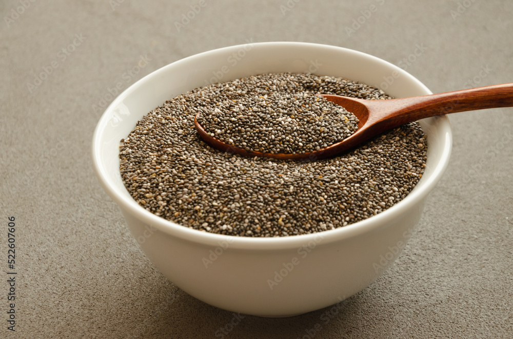 chia seeds in a plate with a wooden spoon for Healthy Nutrition chia seeds in a plate with a wooden spoon for Healthy Nutrition