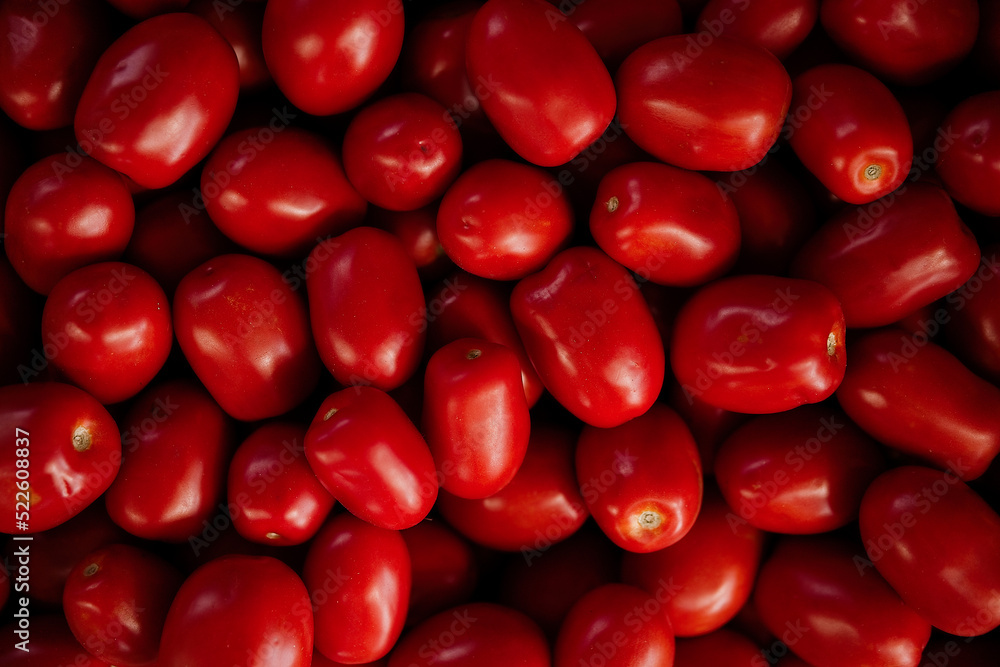 Ripe red tomato close-up background or texture. Tomatoes harvest, many red tomatoes Ripe red tomato close-up background or texture. Tomatoes harvest, many red tomatoes