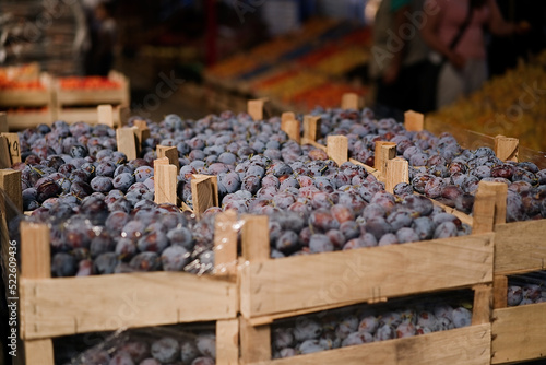 Obraz na płótnie Fresh plums fruit boxes sold in the market