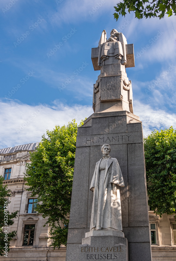London, UK- July 4, 2022: Off Trafalgar Square. Closeup of Edith Cavell Memorial is stone obelisk with Marble statues featuring her image and appealing humanity on St. Martin Place.