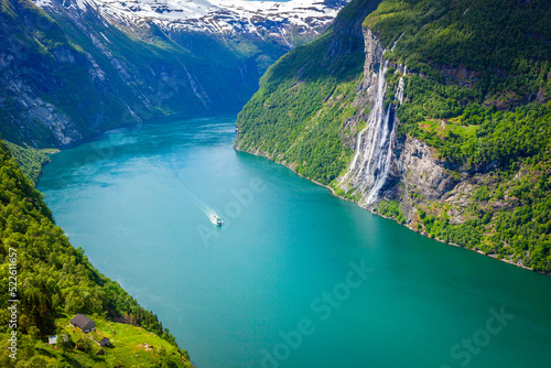 Ferry ship crossing Geirangerfjord and Seven Sisters Waterfalls, Norway