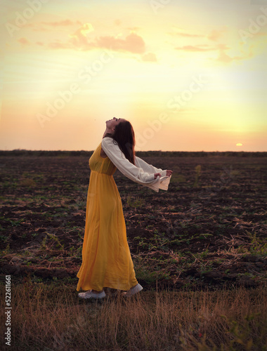 Young woman relaxed dancing with closed eyes