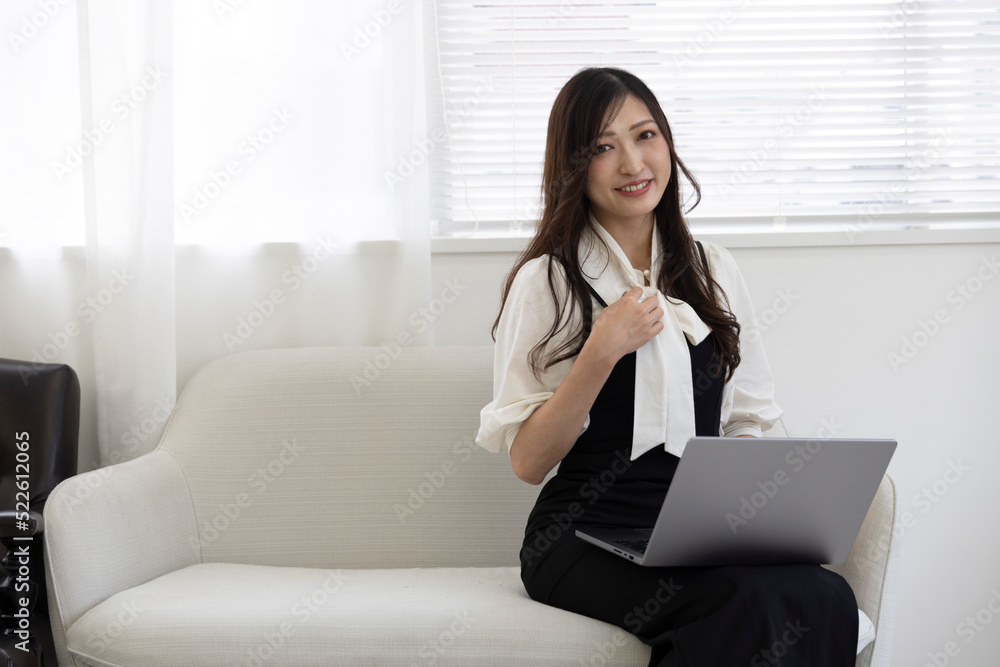 A working Japanese woman by remote work in the home office closeup A working Japanese woman by remote work in the home office closeup