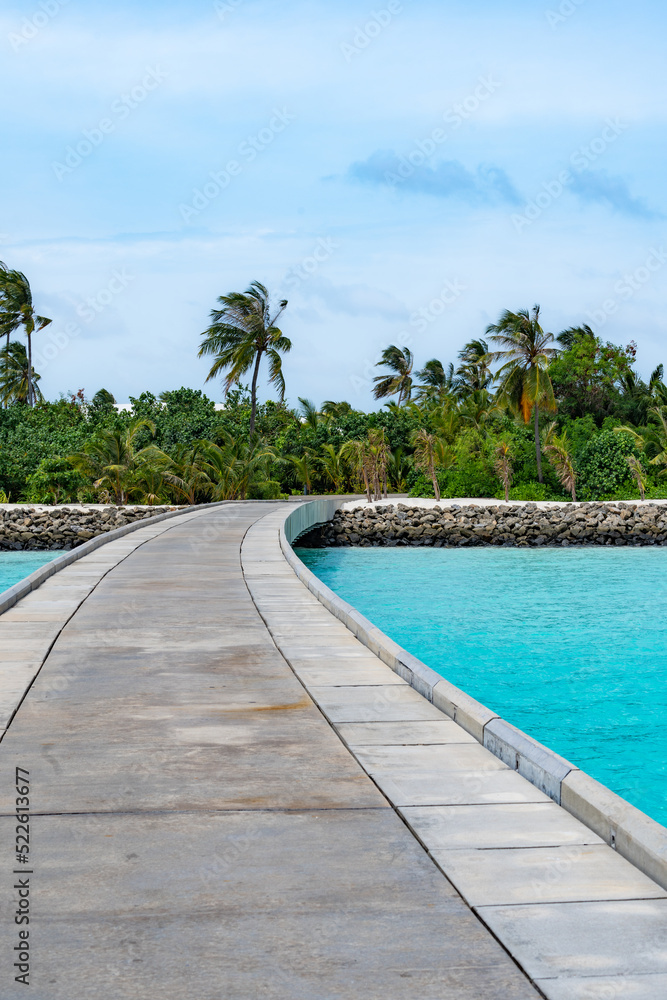 Maldives resort bridge in tropical, exotic paradise with turquoise water