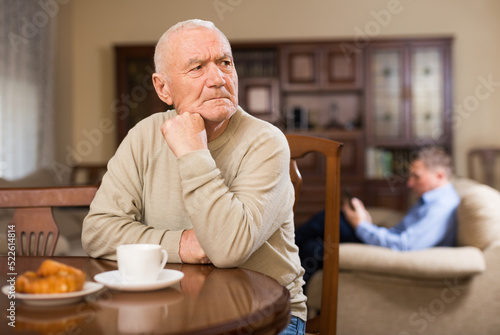 Tableau sur toile Adult son dissatisfied with his father, chastises him at home