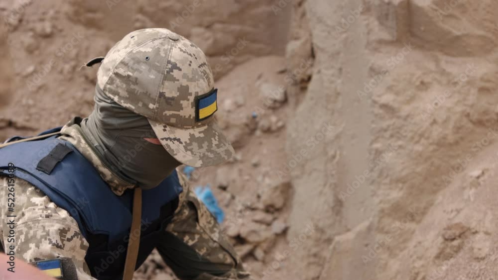 Army soldier, anti-terrorist team combat engineer, ammunition technical officer, explosives military expert, saboteur with explosives in their hands, miners prepare explosive devices. Army soldier, anti-terrorist team combat engineer, ammunition technical officer, explosives military expert, saboteur with explosives in their hands, miners prepare explosive devices.
