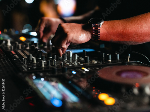 a dj playing music in a nightclub © enginakyurt