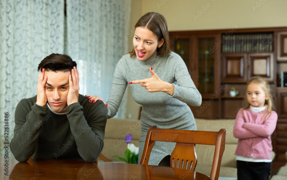 Family of three with teenager boy having quarrel at home. High quality photo