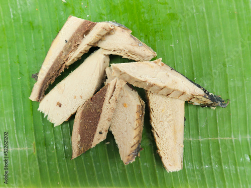 Raw Mackerel Tuna (Tongkol Pindang) with banana leaf base photo