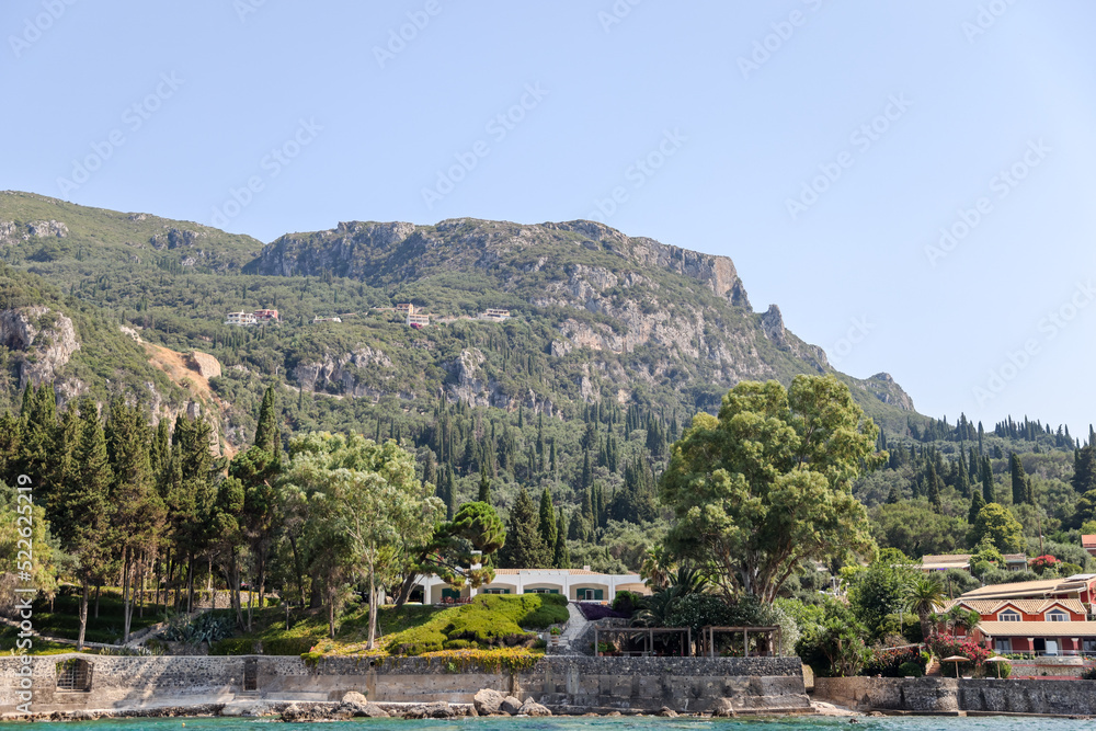 Rocky seasides and ocean views of the coastline of Corfu on a sunny day