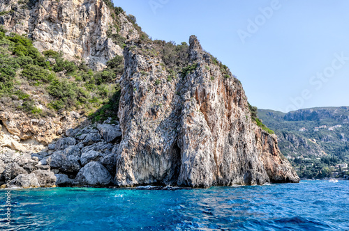 Rocky seasides and ocean views of the coastline of Corfu on a sunny day © Torval Mork