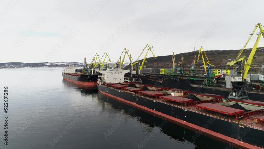 Sea view to ship that has finished loading coal and preparing to sail avay from port Sea view to ship that has finished loading coal and preparing to sail avay from port