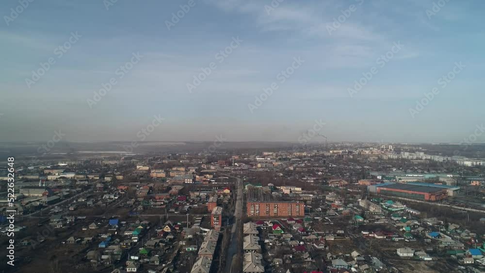 Panorama of polar city in Russia. Low-rise buildings against backdrop of smoking chimneys of industrial enterprises Panorama of polar city in Russia. Low-rise buildings against backdrop of smoking chimneys of industrial enterprises