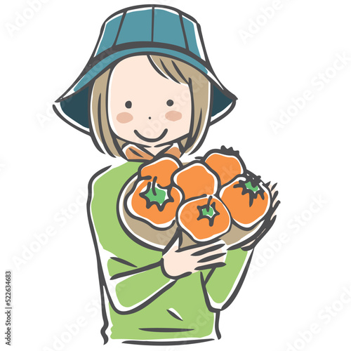 収穫した柿を紹介する作業姿の女性