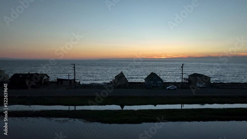 Aerial view of waterfront houses on Whidbey Island during sunset. photo