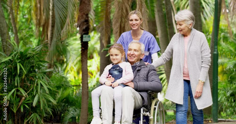 Family, healthcare and caregiver while a little girl visit her grandparents at an assisted living facility. A nurse pushing her elderly patient in a wheelchair while on relaxing walk through a park Family, healthcare and caregiver while a little girl visit her grandparents at an assisted living facility. A nurse pushing her elderly patient in a wheelchair while on relaxing walk through a park