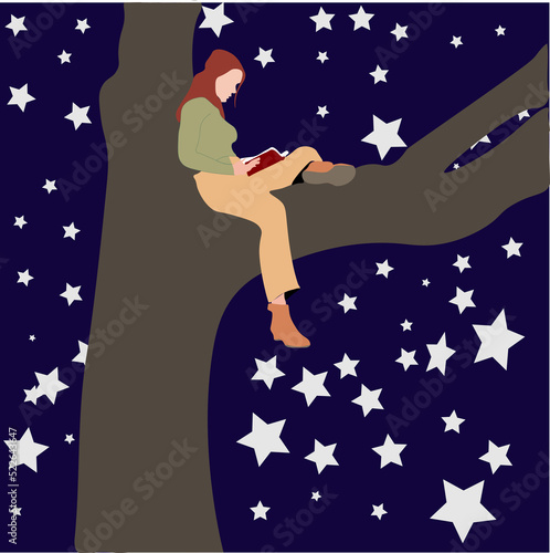 A woman in hijab sits on a tree at night reading a book.