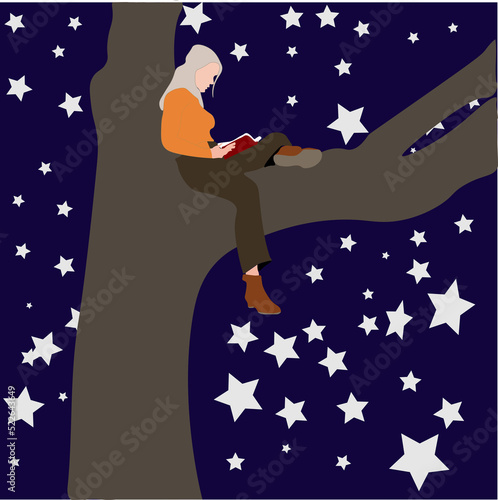 woman sitting on a tree at night reading a book.
