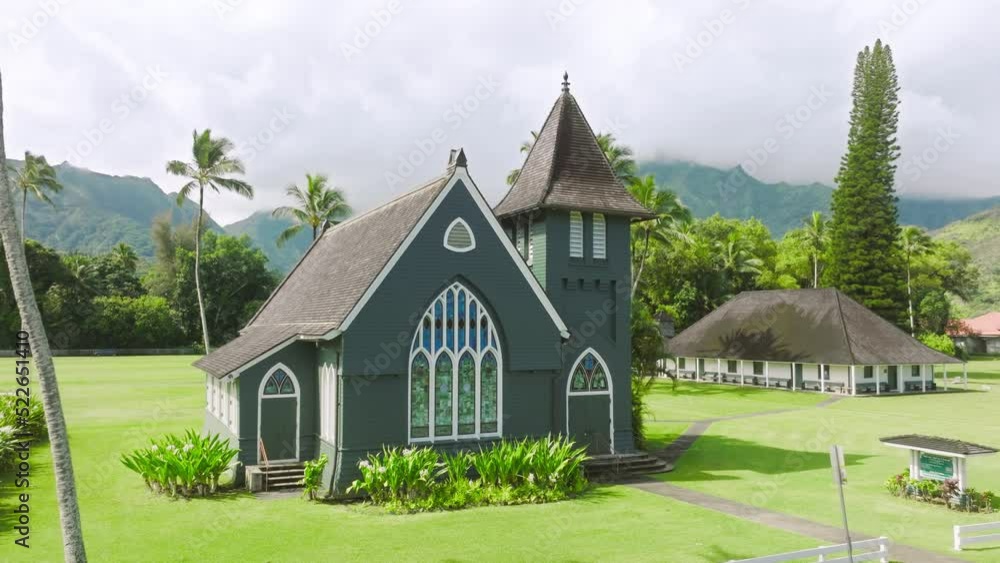 Waioli Huiia Church in Haena town on North Shore of Kauai island, Hawaii on sunny summer day. Historic Christian church in American gothic style with tower bell on cinematic island nature background Waioli Huiia Church in Haena town on North Shore of Kauai island, Hawaii on sunny summer day. Historic Christian church in American gothic style with tower bell on cinematic island nature background