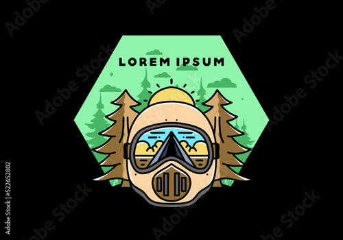 a trail helmet with a pine tree beside