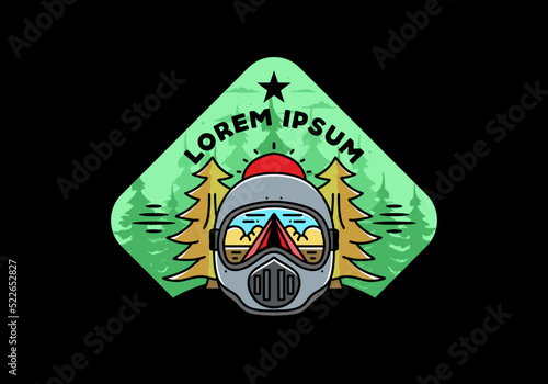 a trail helmet with a pine tree beside