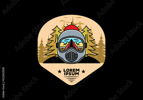a trail helmet with a pine tree beside