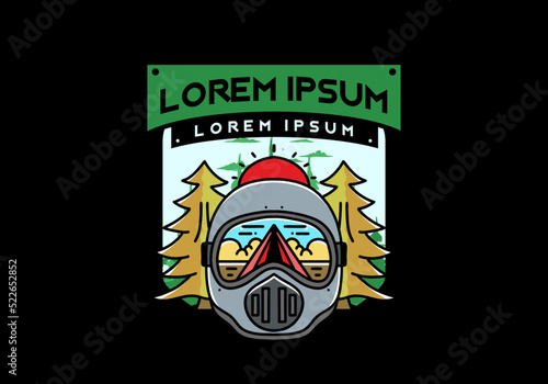 a trail helmet with a pine tree beside