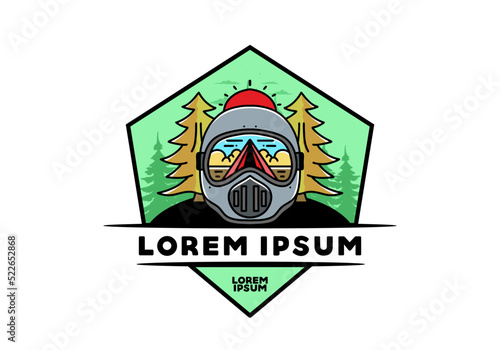 a trail helmet with a pine tree beside