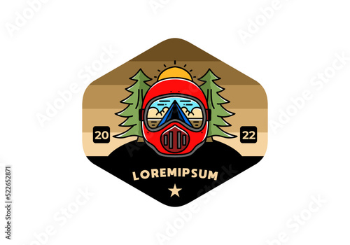 a trail helmet with a pine tree beside
