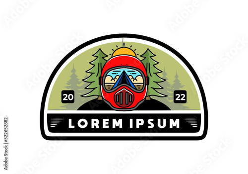 a trail helmet with a pine tree beside