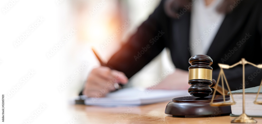 Female lawyer working in office. Law and justice concept.