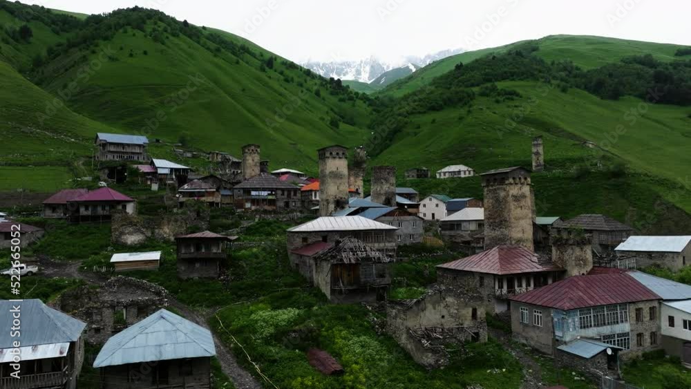 An Old Mountain Village With Caucasus Mountainscape Background In Adishi, Svaneti Region, Georgia. Aerial Drone Shot An Old Mountain Village With Caucasus Mountainscape Background In Adishi, Svaneti Region, Georgia. Aerial Drone Shot