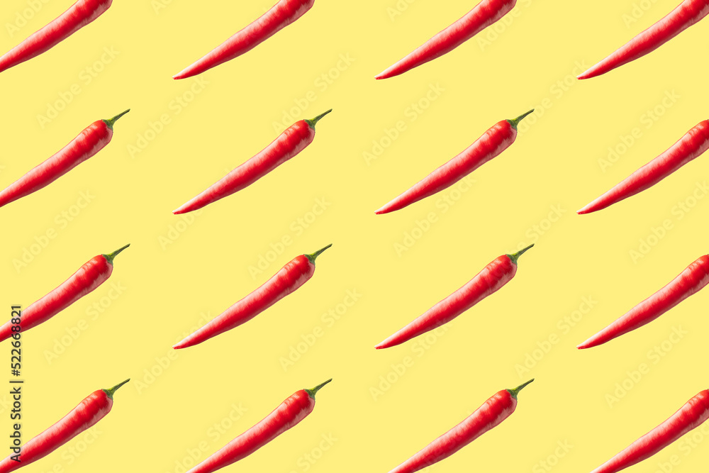 Red hot chili peppers on yellow background. Seamless repeating pattern. Red hot chili peppers on yellow background. Seamless repeating pattern.
