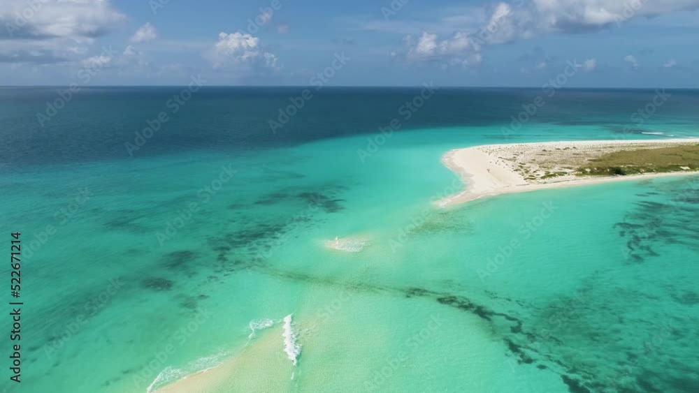 Drone shot over Cayo de Agua tropical island without peculiar isthmus, Los Roques Venezuela Drone shot over Cayo de Agua tropical island without peculiar isthmus, Los Roques Venezuela