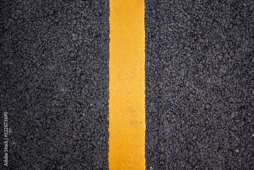New asphalt road surface with yellow line background © tendo23