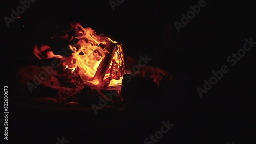 Fiery hot flammable fireplace burning wood to keep warm and teach survival skills in 120 fps during hot black summer night  photo
