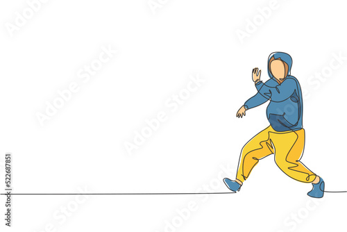 One single line drawing of young modern street dancer man with hoodie performing hip hop dance on the stage vector illustration graphic. Urban generation lifestyle concept. Continuous line draw design © Simple Line