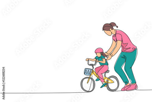 One continuous line drawing of young mother help her daughter learning to ride a bicycle at countryside together. Parenthood lesson concept. Dynamic single line draw graphic design vector illustration